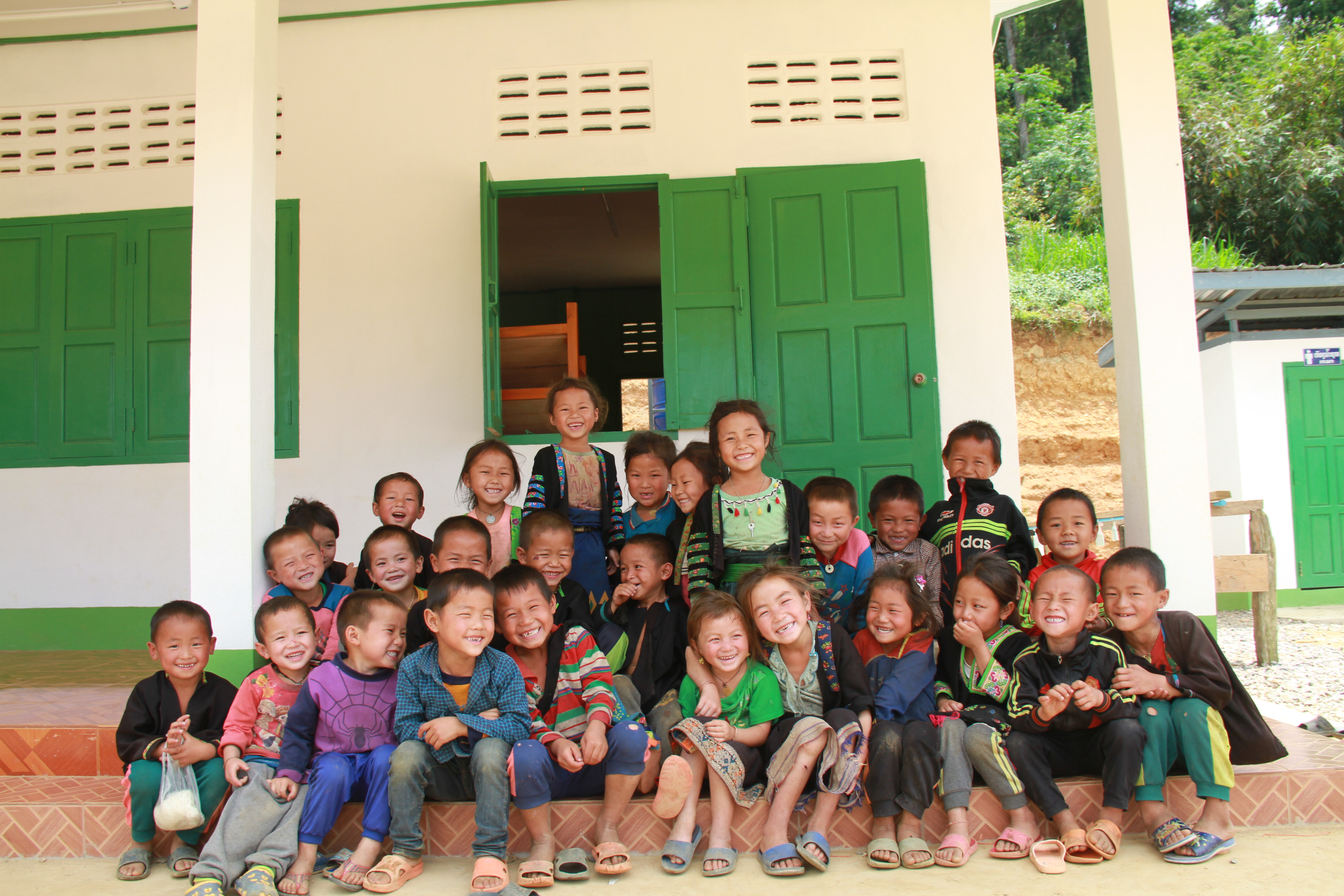 A group of children out the front of their classroom in Laos