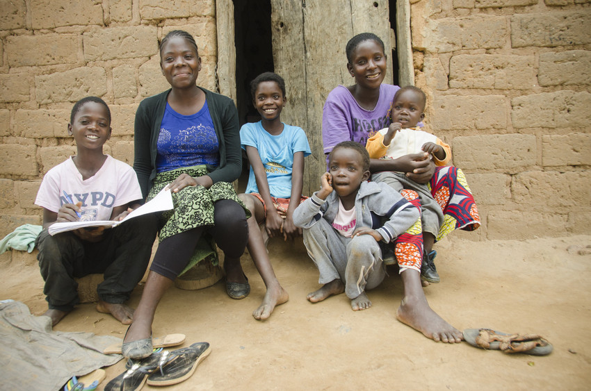 Mavis and her family. From left: Stephen (13), Carol (16), Faris (11), Loveness (5) and Mavis (29), holding Henry, 21 months.
