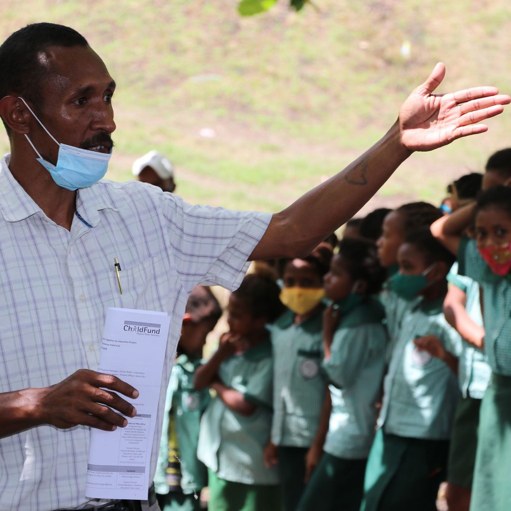 Mr Phillip Solomon addresses a school assemble at Ruatoka Elementary School_compressed